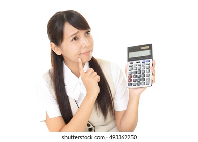 Uneasy Asian business woman - Shutterstock ID 493362250