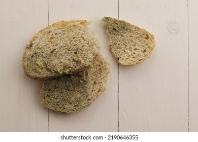 Uneatable slices of bread on table                  