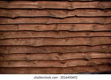 Unedged Planks Background. Wooden Scandinavian Fence. Brown Color Board. Grunge Texture. Flat Lay Mockup Design. Horizontal Line. Backyard Hedge. Countryside Security Exterior. Chalet Or Rustic Style.