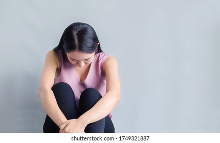 Unemployed Mom, She Is Very Sad And Thinking Because The Corona Outbreak Of The Covid-19 Virus Is The Cause Of New Normal Around The World. Causing Many Unemployed. Mental Woman On White Background 