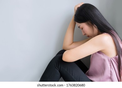 Unemployed Mom, She Is Very Sad And Thinking Because The Corona Outbreak Of The Covid-19 Virus Is The Cause Of New Normal Around The World. Causing Many Unemployed. Mental Woman On White Background 