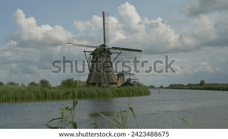 unesco iconic windmills Kinderdijk Netherlands sunny day