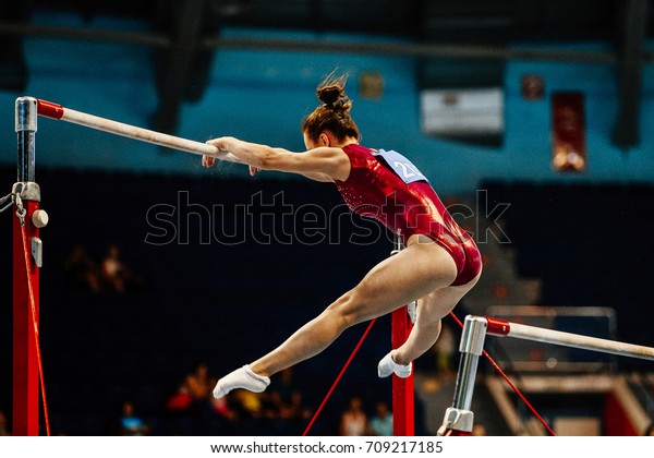 uneven bars female gymnast to competition in\
artistic gymnastics