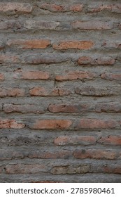The uneven texture and mortar lines create a rich visual pattern. This seamless texture is ideal for design projects, mockups, and interior decoration backgrounds.