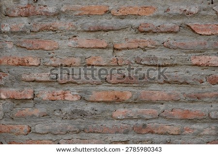 The uneven texture and mortar lines create a rich visual pattern. This seamless texture is ideal for design projects, mockups, and interior decoration backgrounds.