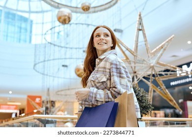 unexplainable joy, pleasure, and excitement.magical and therapeutic pastime, smiling girl with handbags looking up, low view.therapy - Powered by Shutterstock