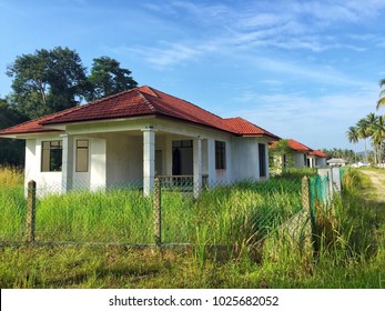 Unfinish project or abandoned house with sunrise and blue sky.