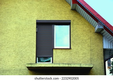 Unfinished balcony without a railing in a single-family house and window , door with external blinds