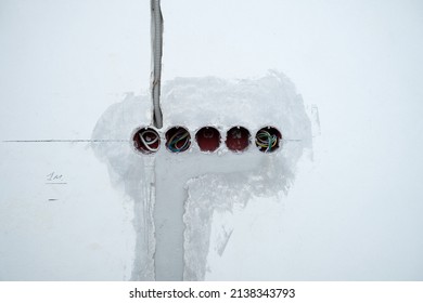 Unfinished Electrical Mains Outlet Sockets With Electrical Wires. Concrete Wall. Repair In Apartment.