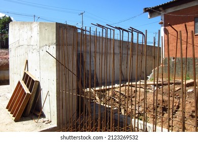 Unfinished reinforced concrete retaining wall, construction wall, building wall rebar exposed - Shutterstock ID 2123269532