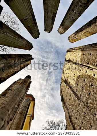 Similar – Schmales Fenster in der Steinmauer mit Blick auf das Pariser Stadtbild