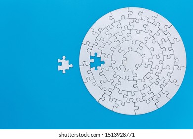 Unfinished White Jigsaw Puzzle Pieces On Blue Background, The Last Jigsaw Puzzle Of Success.