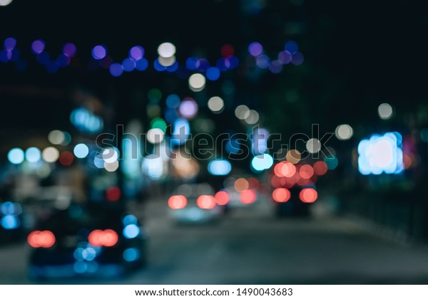 Unfocused image of the city night traffic,\
rear lights, wallpaper; blurred photo\
concept.