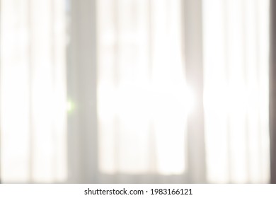 Unfocused Sun Light Through Transparent Curtain On Window