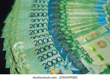 An unfolded stack of 2000 tenge bills. Paper money from circulation                               