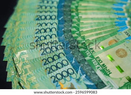 An unfolded stack of 2000 tenge bills. Paper money from circulation                               
