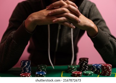 Unfortunate Young Man Feeling Sad, Desperate And Stressed After Losing His Money Playing Poker And Blackjack In A Nightly Casino. Copy Space