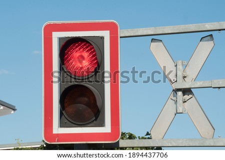 ungated railroad crossing with level crossing sign or St. Andrew's cross