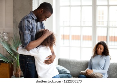 Unhappy African American Family In Living Room At Home, Sad Father Embracing Little Preschooler Daughter, Child Stay With Mother, Dad Leave, Saying Goodbye, Parents Divorce, Break Up Concept