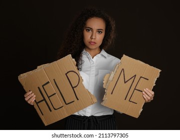 Unhappy African American Woman With HELP ME Sign On Dark Background