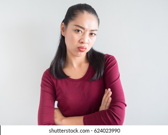 Unhappy And Annoyed Face Of Asian Woman Standing.