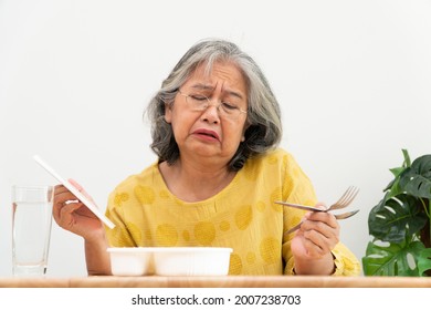 Unhappy Asian Senior Woman Anorexia And Say No To Ready Meals, Elderly Home Alone And Bored Food And No Appetite