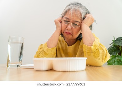 Unhappy Asian Senior Woman Anorexia And Say No To Ready Meals, Elderly Home Alone And Bored Food And No Appetite