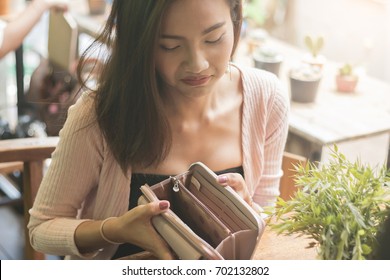 Unhappy Bankrupt Woman With Empty Wallet.  Bankruptcy