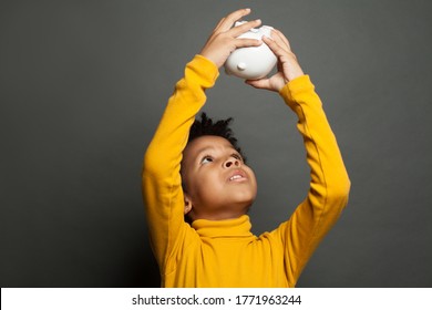 Unhappy Black Child And Empty Piggy Bank Without Money, No Money