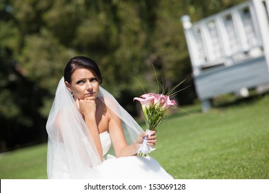 Unhappy Bride With A Wedding Bouquet