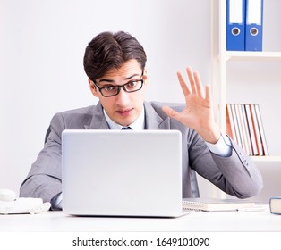 Unhappy businessman working in office - Powered by Shutterstock