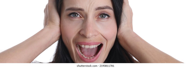 Unhappy Caucasian Female Tenant Or Tenant Covers Ears With Hands Hates Noise Of House. Upset Angry Woman Feeling Overwhelmed Frustrated Suffering From Disturbing Noisy Sound In House