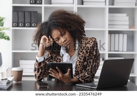 Unhappy confused millennial African American business woman, stuck with difficult task or feeling stressed working with documents, Depressed upset.