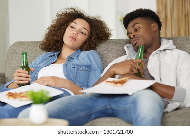 Unhappy Couple Ate Too Much Pizza