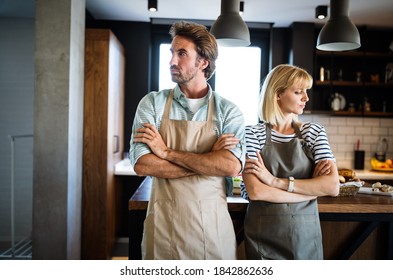 Unhappy Couple Having Argument And Fight In Kitchen That Leads To Divorce