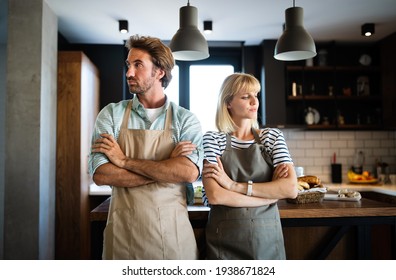 Unhappy Couple Having Argument And Fight In Kitchen That Leads To Divorce