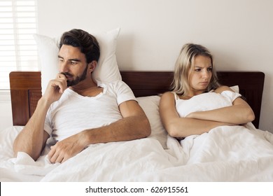 Unhappy Couple Having Problems At Bedroom. Family Conflict.