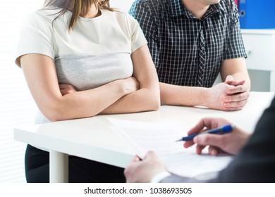 Unhappy Couple In Meeting With Therapist, Psychologist, Divorce Lawyer Or Legal Consultant. Upset Woman And Man Having Fight In Therapy Session Or Marriage Counselling. Custody Battle Or Problems.