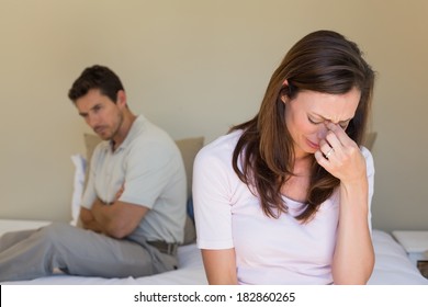 Unhappy Couple Not Talking After An Argument In Bed At Home