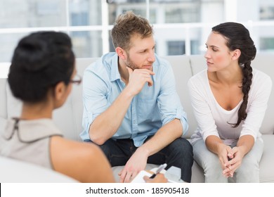 Unhappy Couple At Therapy Session In Therapists Office