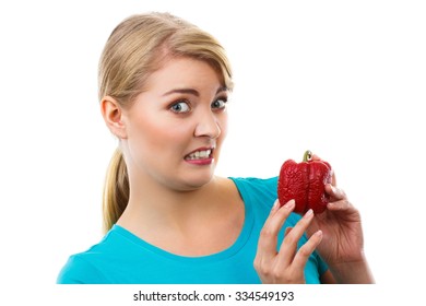 Unhappy And Disgusted Woman Holding In Hand Old Wrinkled Peppers, Unhealthy Food, White Background