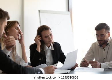 Unhappy diverse colleagues feel stressed losing money experience financial fraud or crisis, frustrated businesspeople distressed with bad work result, paperwork statistics problem or bankruptcy - Powered by Shutterstock