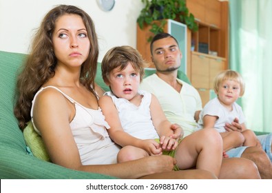 Unhappy Family With Two Little Children  Having Conflict At Home