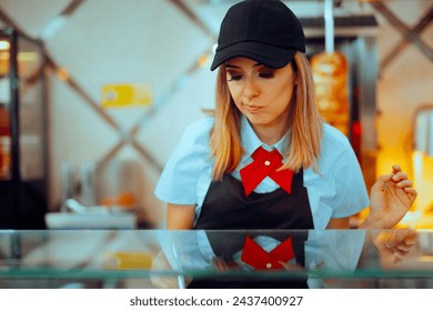 
Unhappy Fast Food Employee Making Mistakes at the Workplace. Unskilled beginner worker failing to so the job tasks 
 - Powered by Shutterstock