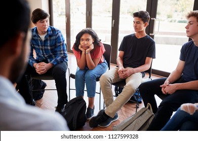 Unhappy Female Pupil In High School Discussion Group
