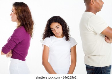 unhappy girl standing between divorcing father and mother