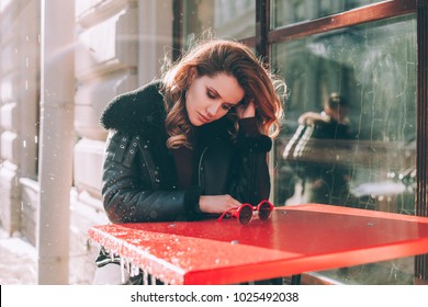 Unhappy Girl In Street Cafe Outdoors. Sad Woman Alone