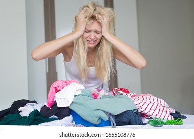 A Unhappy Housewife Doing Laundry And Cleaning At Home. Stay At Home Mom. Depression