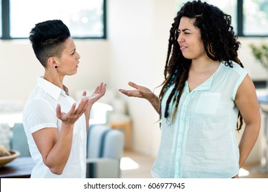 Unhappy Lesbian Couple Arguing With Each Other At Home