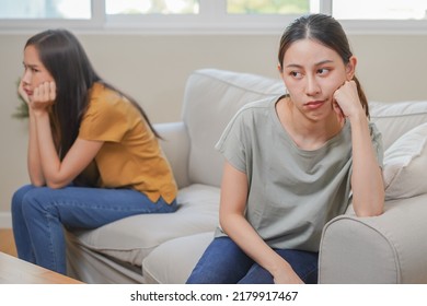 Unhappy Lesbian, Lgbt Asian Young Two Women, Girl Gay, Couple Love Fight On Sofa, Relationship Is In Trouble. Different People Are Angry And Use Emotions At Each Other, Expression Of Disappointmen.